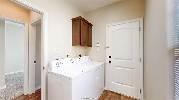 a utility room with dryer and washer