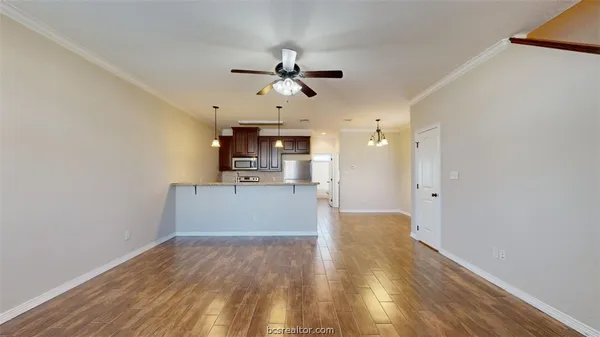 a view of a kitchen with a sink and cabinet