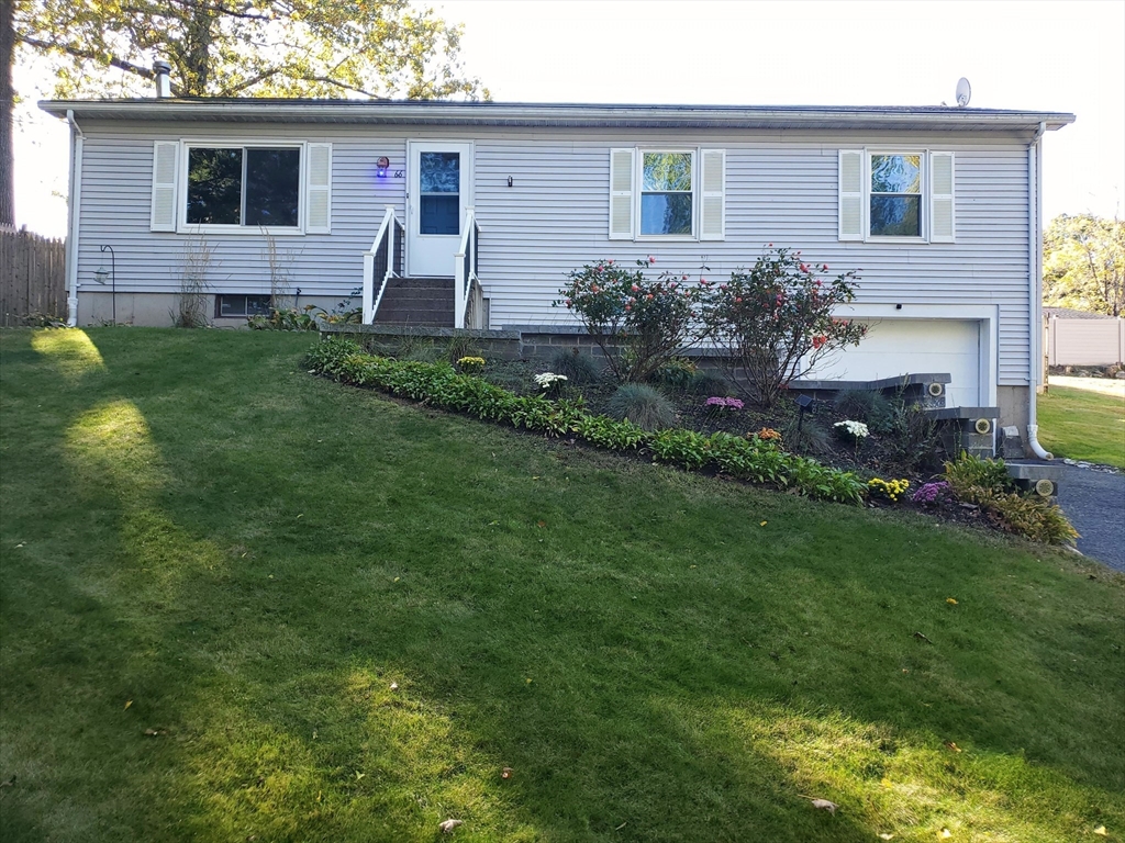 66 Walsh Street Springfield, MA 01109 - Photo 1 of 24 a front view of house with a garden