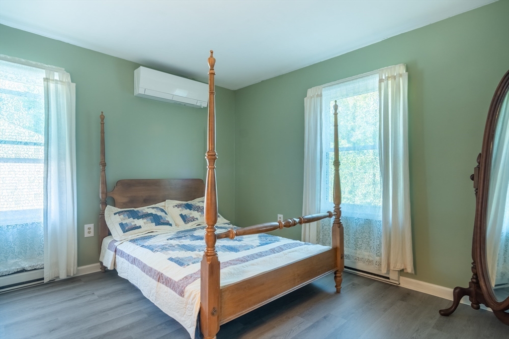 66 Walsh Street Springfield, MA 01109 - Photo 12 of 24 a bedroom with a bed and large window