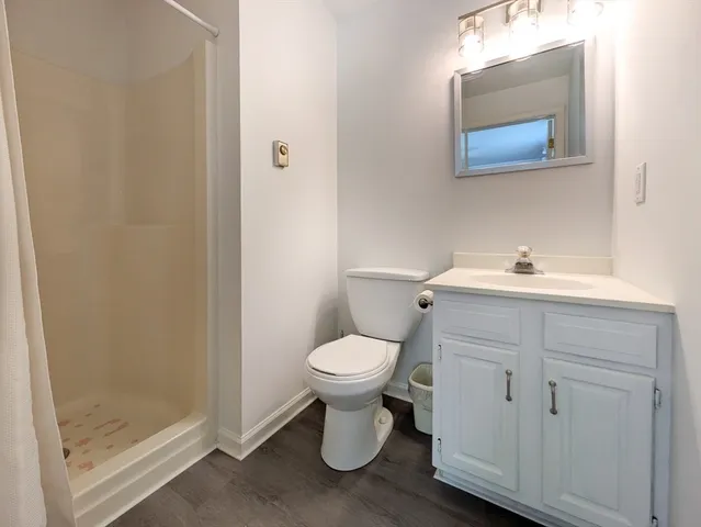 a view of a patio with table and chairs under an umbrella