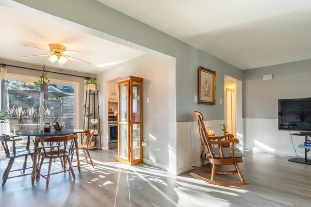 a dining room with furniture and wooden floor