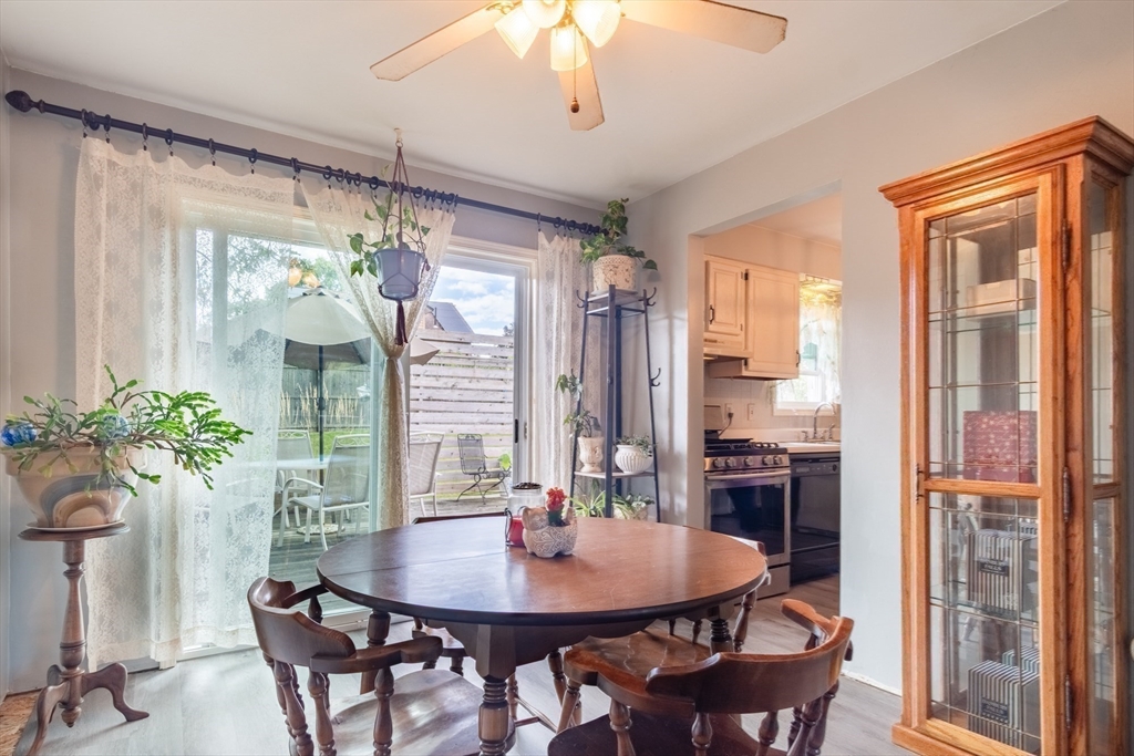 66 Walsh Street Springfield, MA 01109 - Photo 5 of 24 a view of a dining room with furniture window and wooden floor