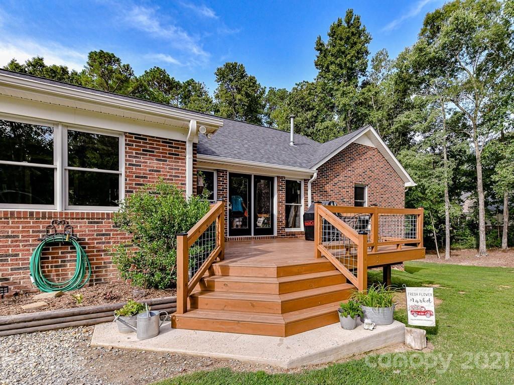 1305 Tom Boyd Road Monroe, NC 28110 - Photo 40 of 48 a front view of a house with a yard