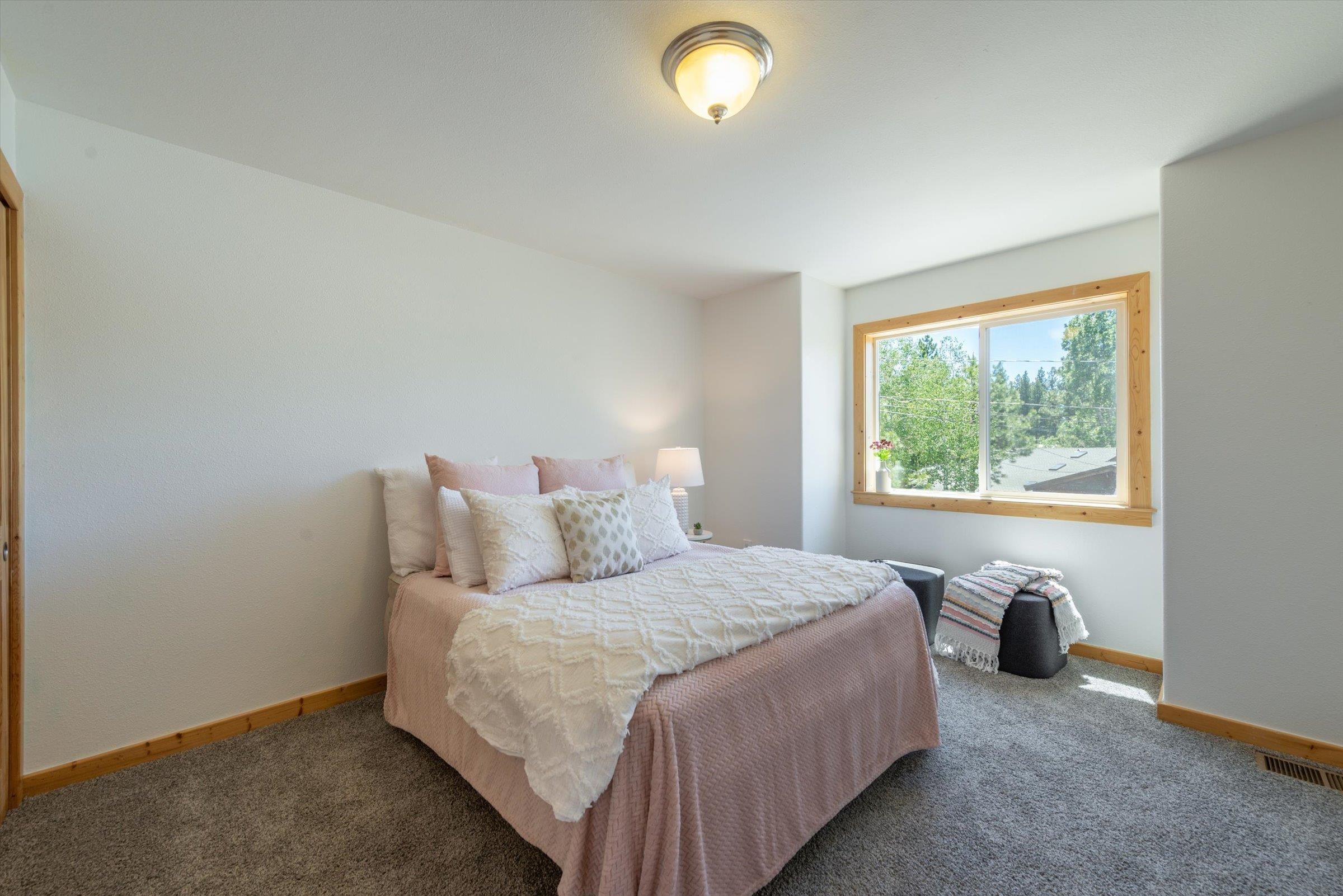 10309 Evensham Place Truckee, CA 96161 - Photo 17 of 21 a bedroom with a bed and a window