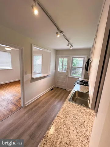 a view of a living room and wooden floor