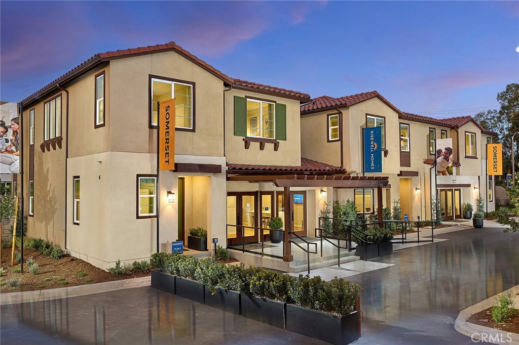 12716 Rosemount Road Eastvale, CA 92880 - Photo 1 of 22 a front view of a house with lake view and trees