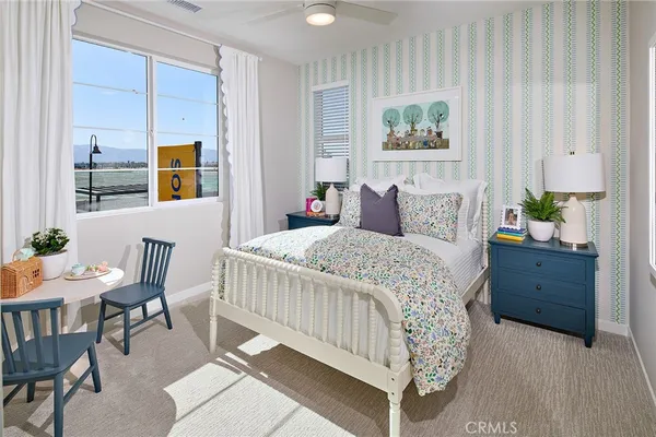 a bedroom with a bed and a table