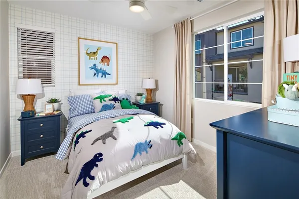 a bedroom with a bed and a table in it