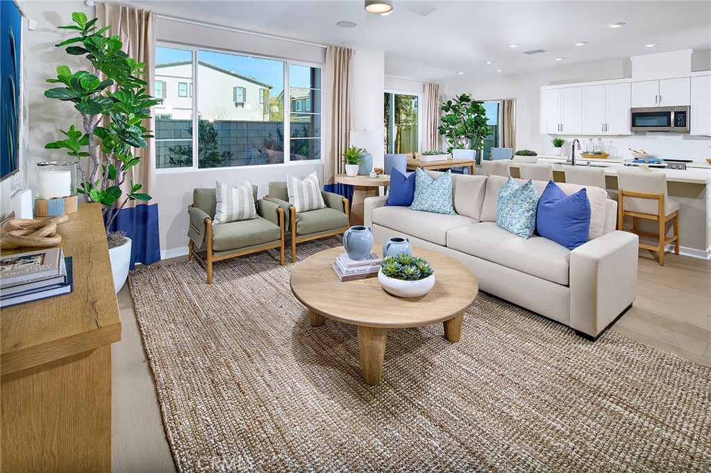 12716 Rosemount Road Eastvale, CA 92880 - Photo 3 of 22 a living room with furniture and a large window