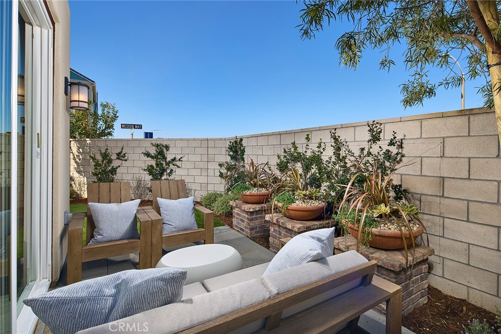 12716 Rosemount Road Eastvale, CA 92880 - Photo 5 of 22 a view of a chairs and table in patio