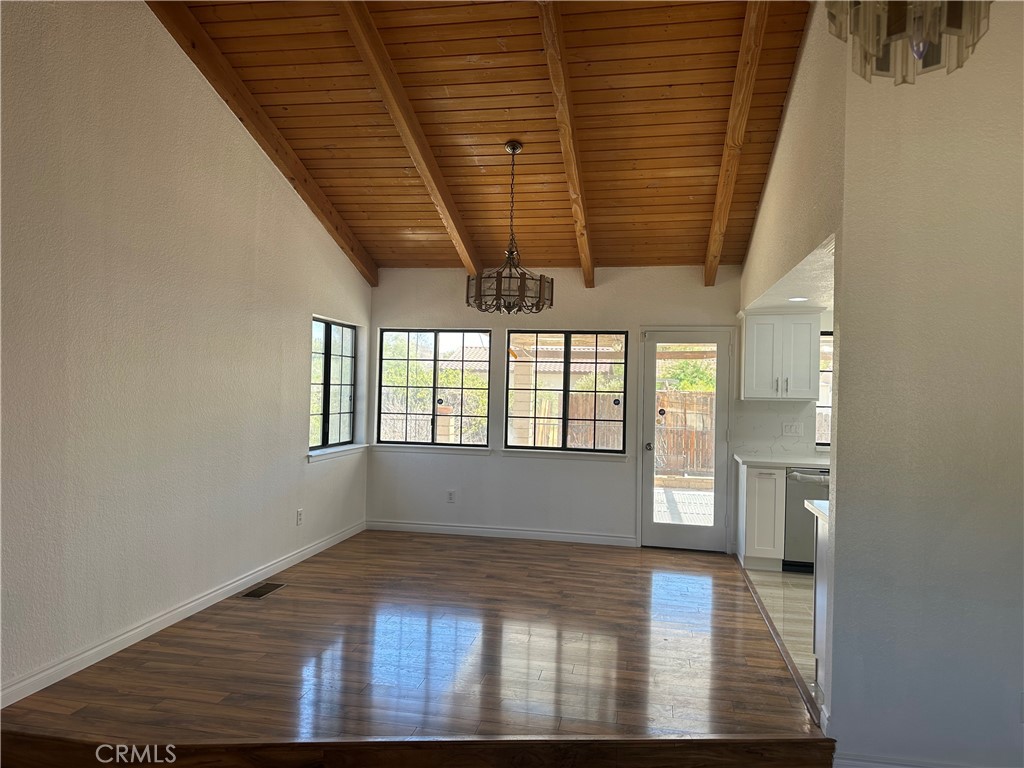 16485 Wintun Road Apple Valley, CA 92307 - Photo 13 of 36 a view of empty room with wooden floor and fan