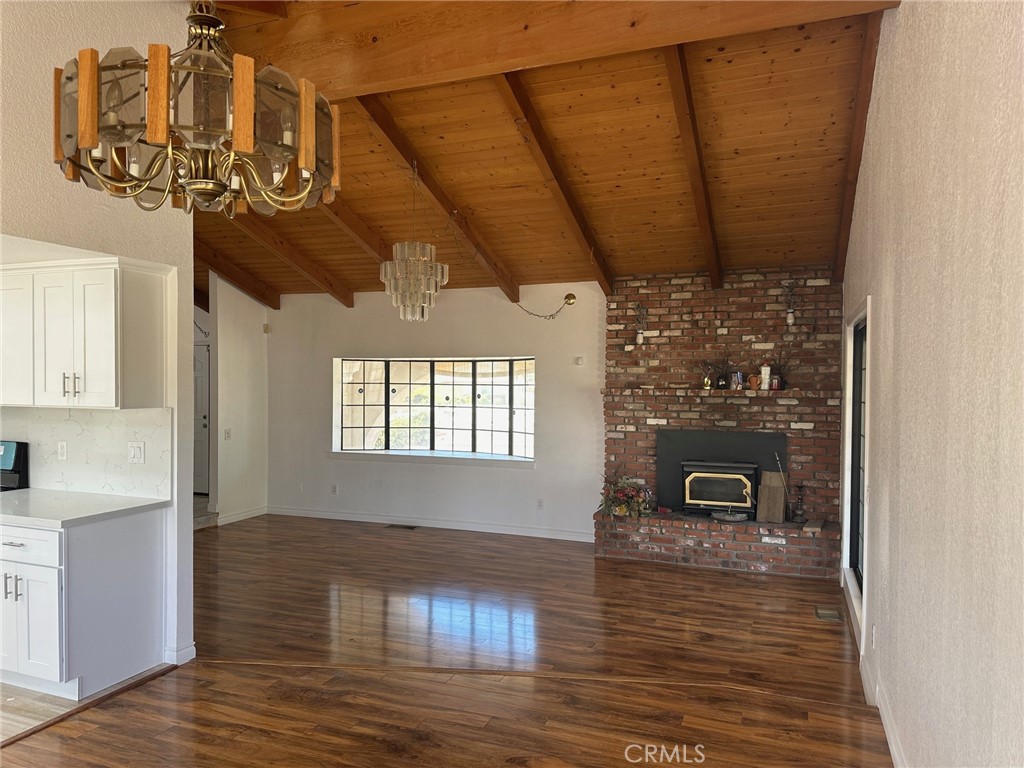 16485 Wintun Road Apple Valley, CA 92307 - Photo 15 of 36 a view of a livingroom with furniture wooden floor and a chandelier