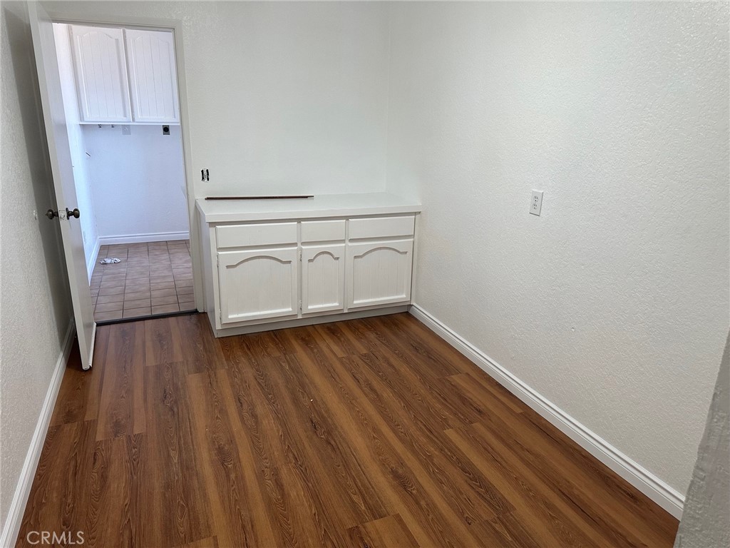 16485 Wintun Road Apple Valley, CA 92307 - Photo 18 of 36 a view of an empty room with wooden floor