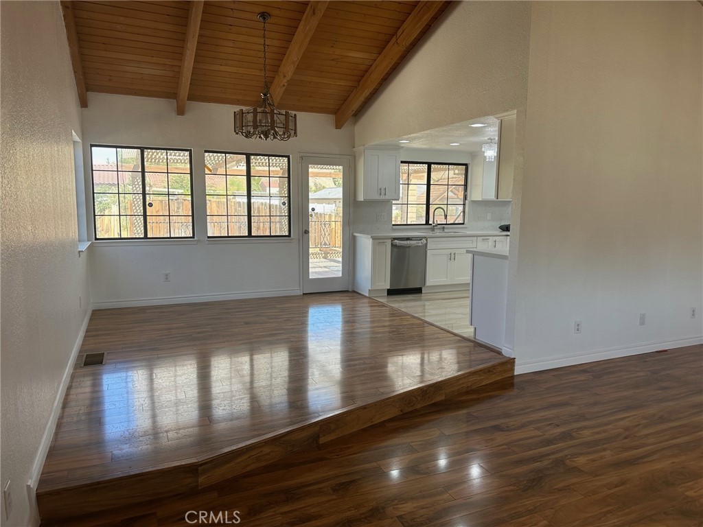 16485 Wintun Road Apple Valley, CA 92307 - Photo 26 of 36 wooden floor in an empty room with a window