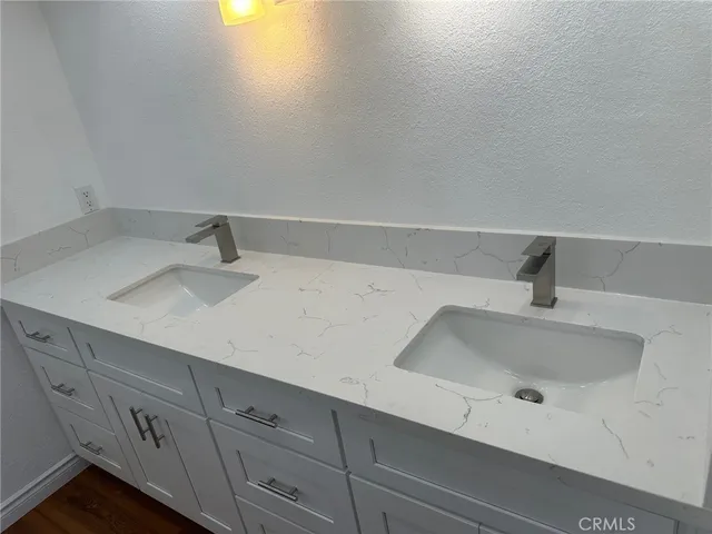 a bathroom with a sink and vanity