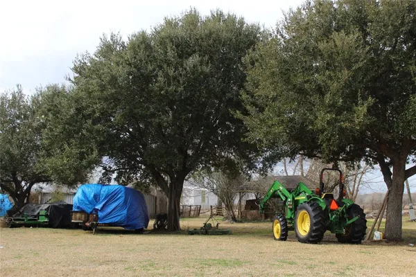 a view of a house with a tree in the background