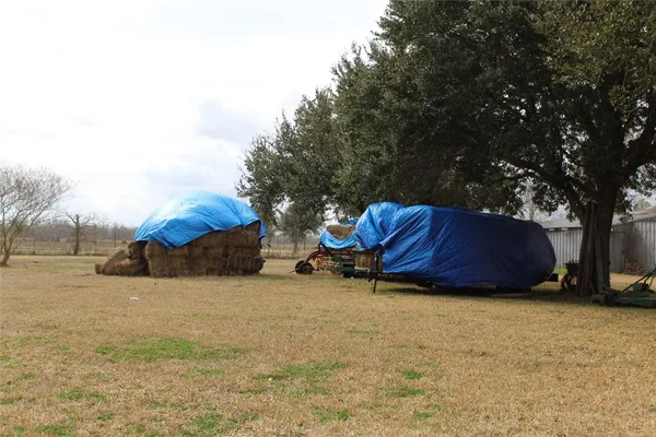 a view of a house with a yard and covered with snow