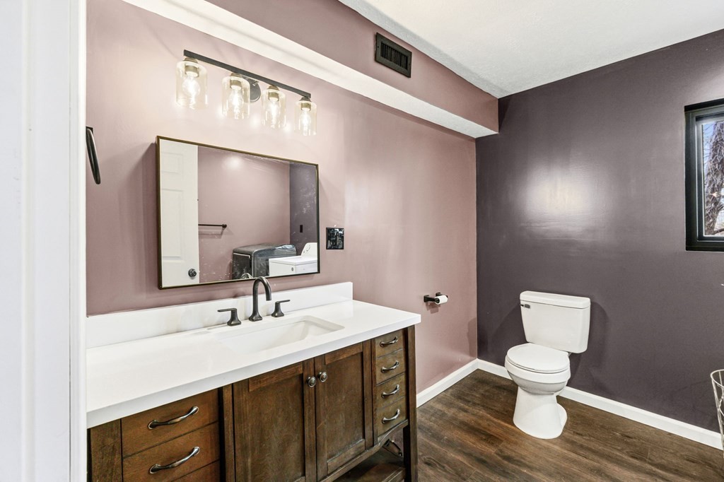 939 Watauga Road Cookeville, TN 38506 - Photo 14 of 28 a bathroom with a toilet sink and mirror