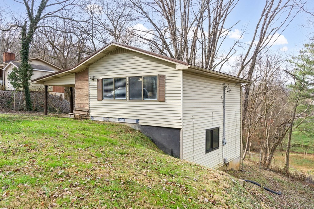 939 Watauga Road Cookeville, TN 38506 - Photo 16 of 28 a front view of a house with a yard