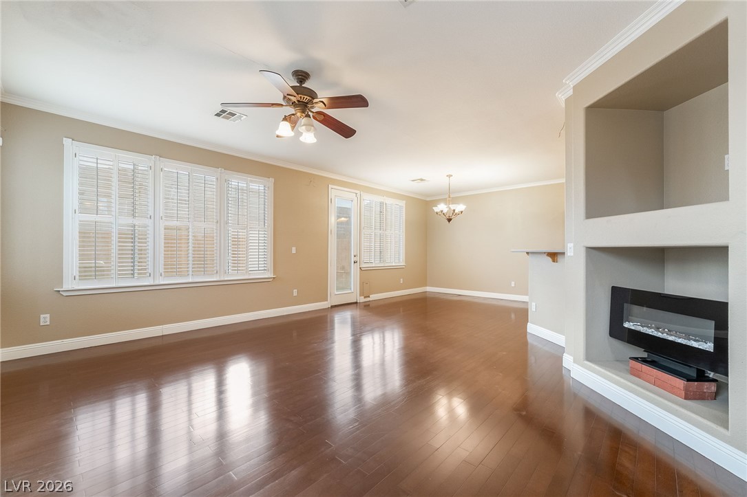 224 Positive Point Street Henderson, NV 89012 - Photo 5 of 44 Gleaming hardwood floors and a modern fireplace define this open living space.