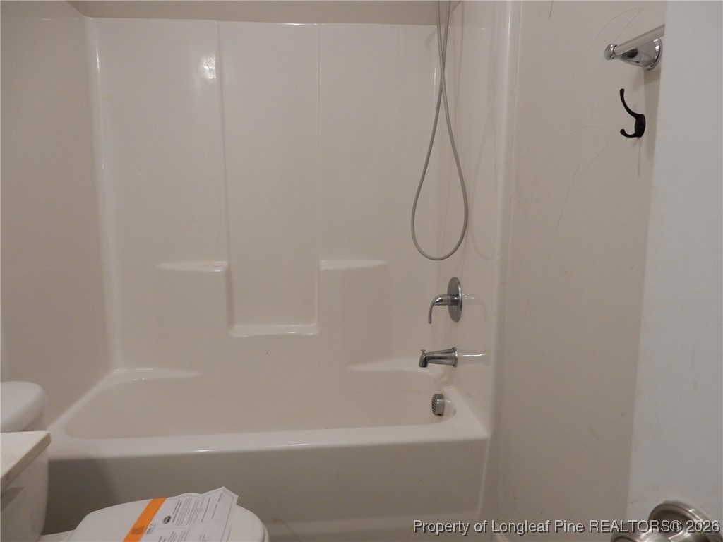 111 South Dakota Court Spring Lake, NC 28390 - Photo 14 of 29 a bathroom with a bath tub with a shower