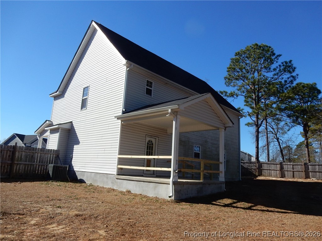 111 South Dakota Court Spring Lake, NC 28390 - Photo 29 of 29 a view of a house with a large window and a yard