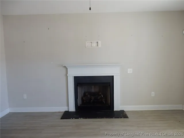 a kitchen with stainless steel appliances granite countertop a stove a sink and a chandelier