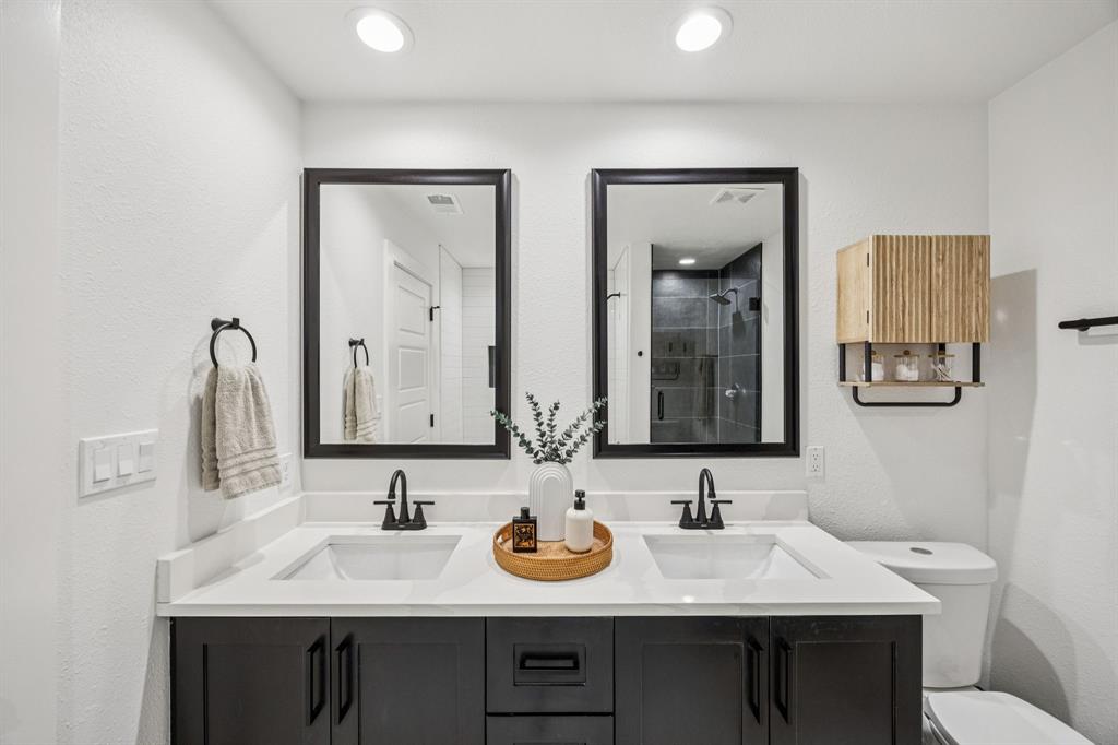 1609 Knight Trail Little Elm, TX 75036 - Photo 15 of 28 a bathroom with double sink and a mirror