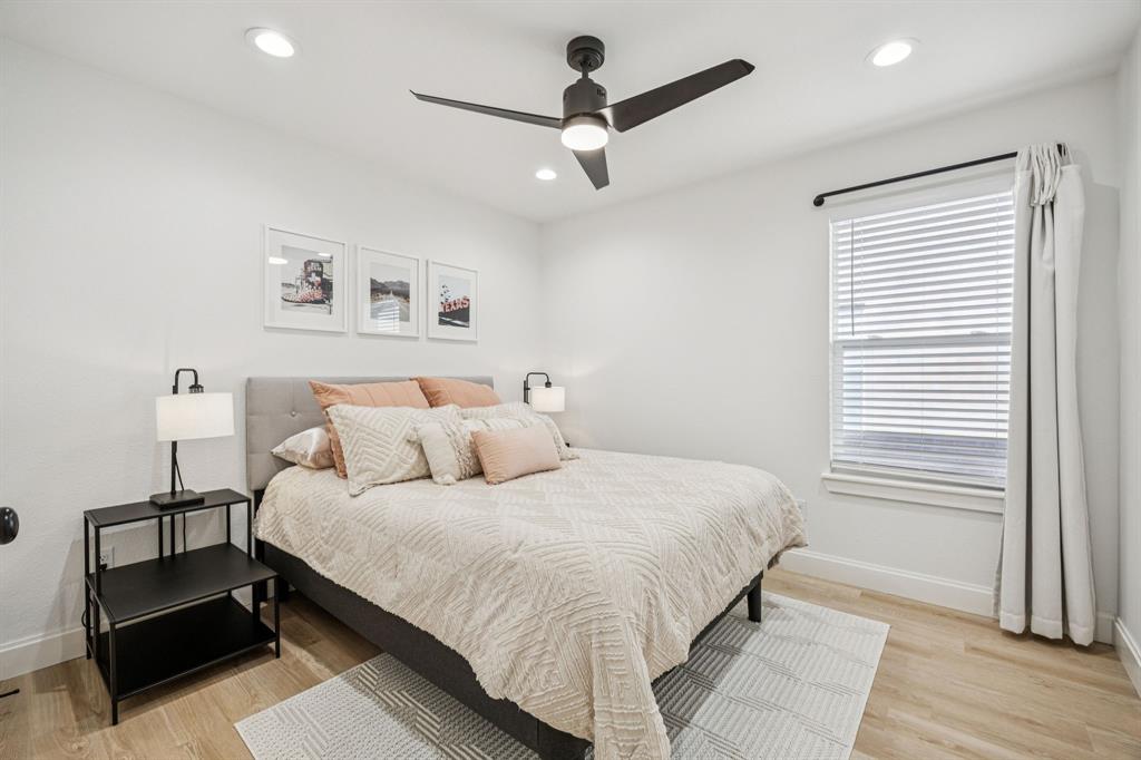 1609 Knight Trail Little Elm, TX 75036 - Photo 22 of 28 a bedroom with a bed and a window