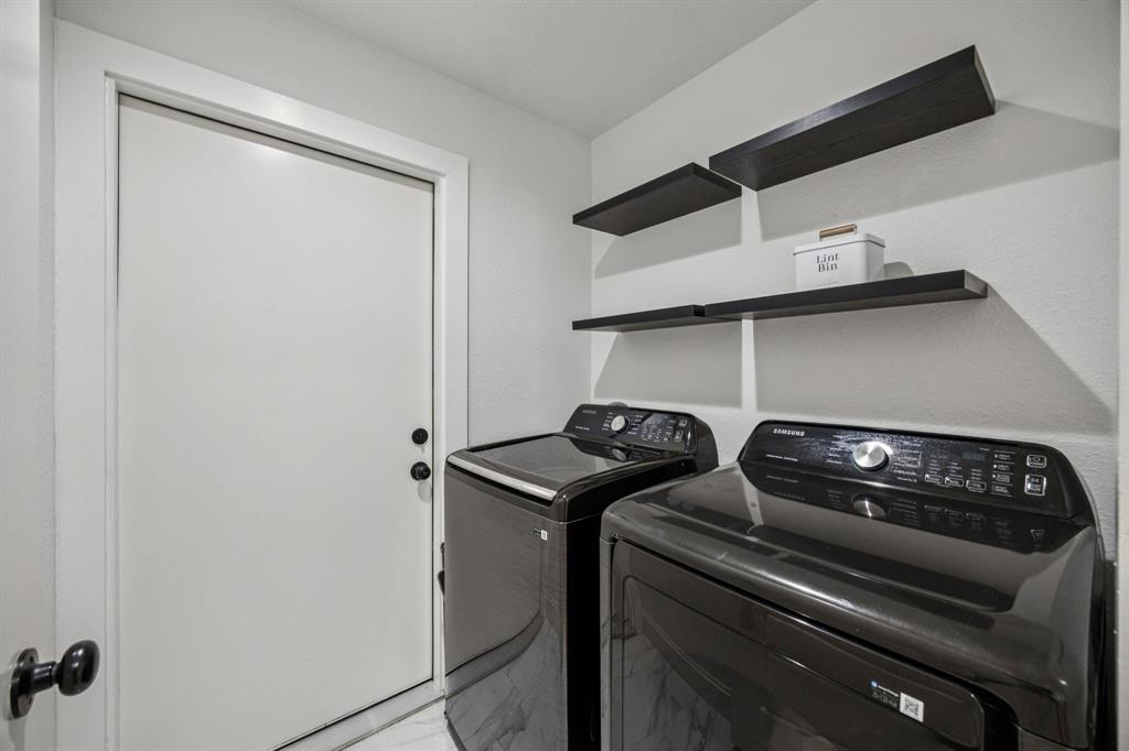 1609 Knight Trail Little Elm, TX 75036 - Photo 23 of 28 a close view of a sink a stove and storage