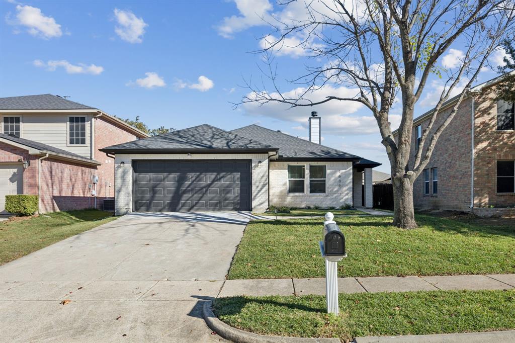 1609 Knight Trail Little Elm, TX 75036 - Photo 25 of 28 a front view of a house with garden