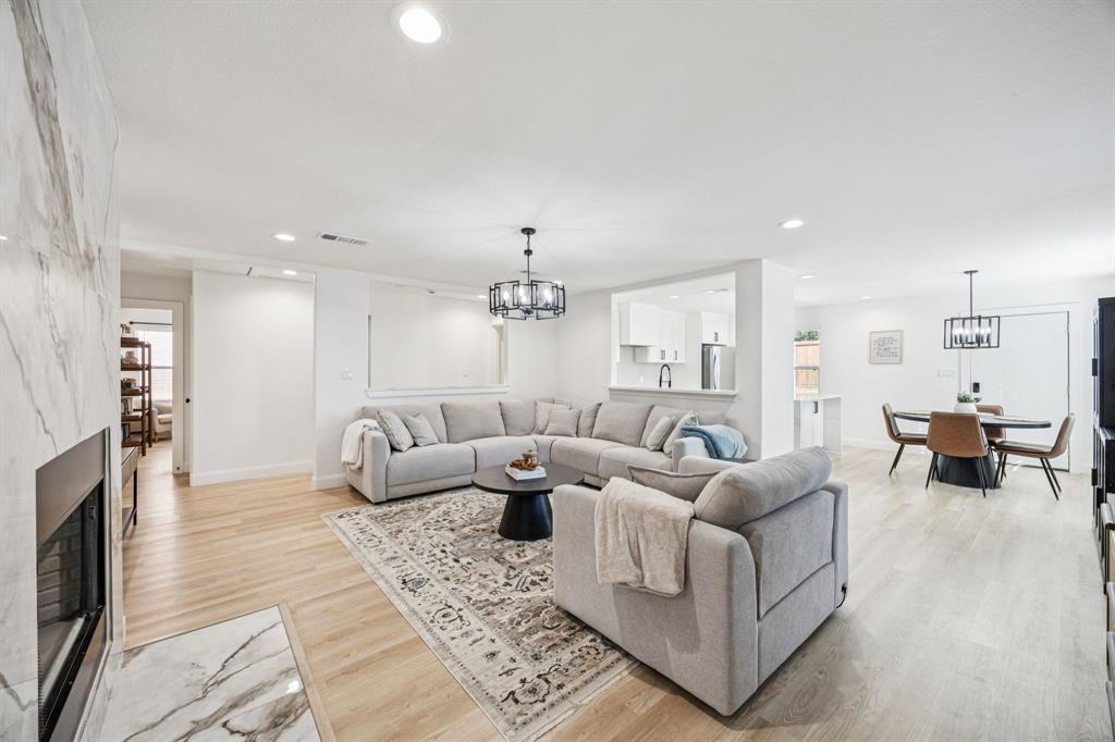 1609 Knight Trail Little Elm, TX 75036 - Photo 5 of 28 a living room with furniture and a fireplace