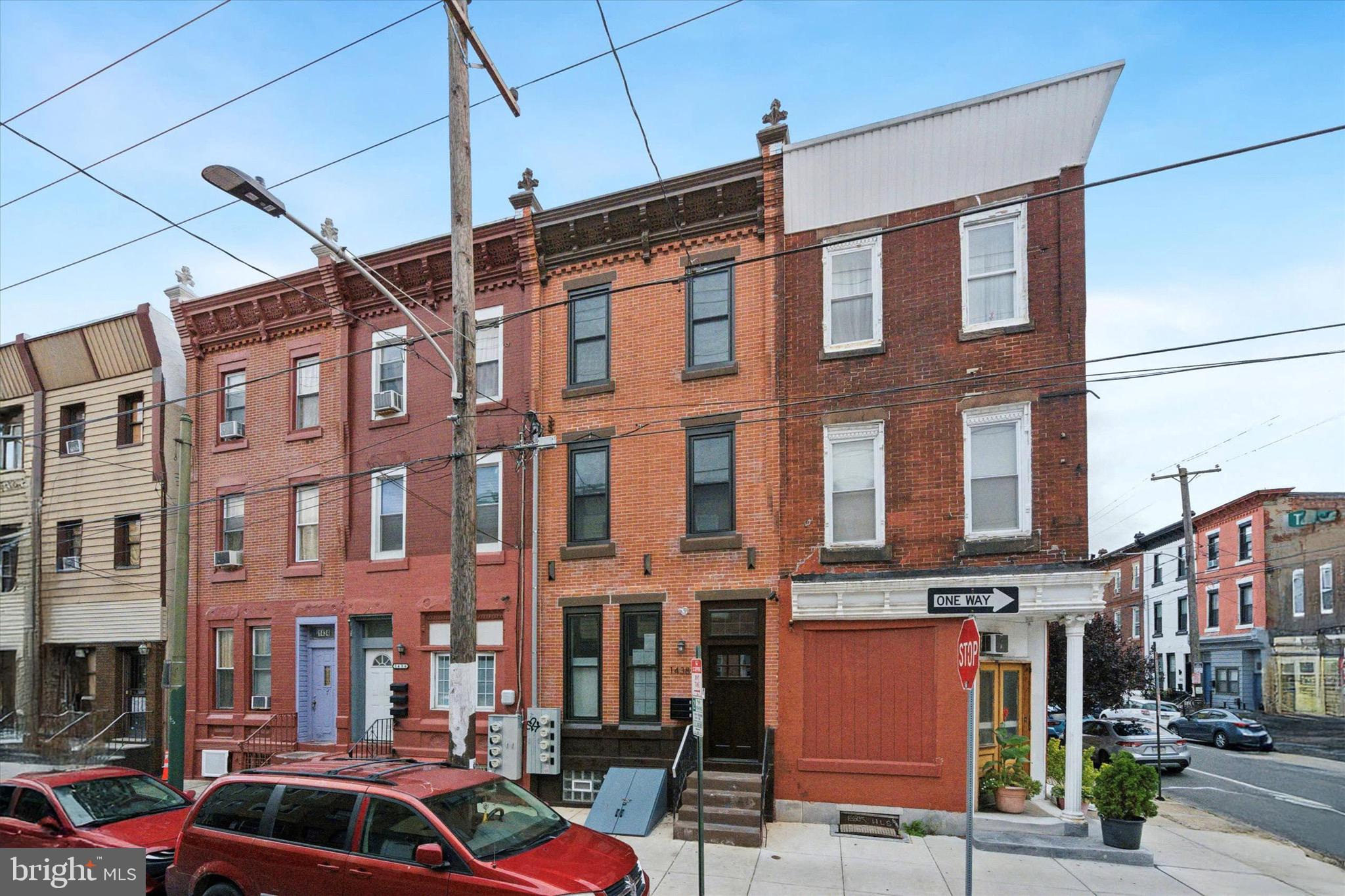 1438 Tasker Street, Unit 1 Philadelphia, PA 19145 - Photo 1 of 16 a front view of a building with street view