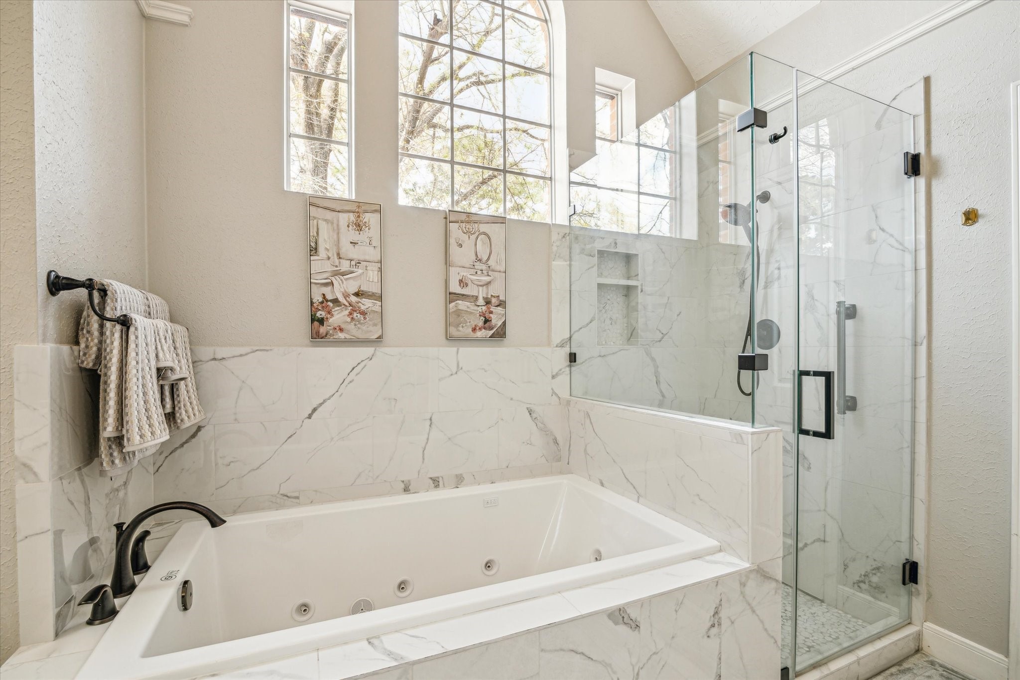 15314 Ripplewind Lane Houston, TX 77068 - Photo 15 of 24 a bathroom with a bathtub and a shower