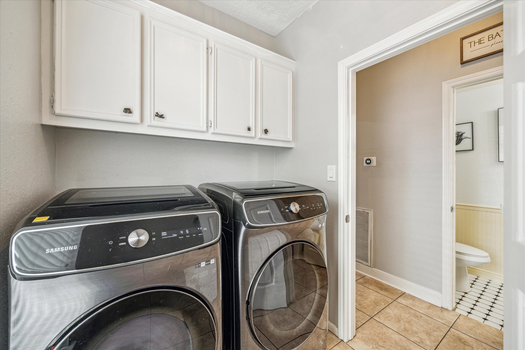 15314 Ripplewind Lane Houston, TX 77068 - Photo 22 of 24 a utility room with dryer and washer