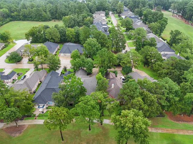 an aerial view of residential house with outdoor space and street view