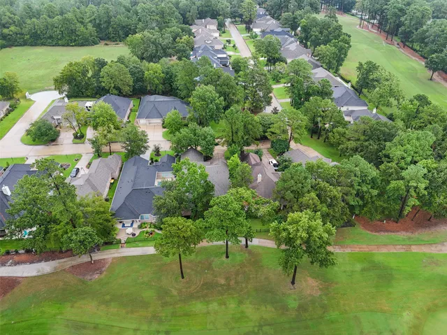 an aerial view of residential house with outdoor space and lake view