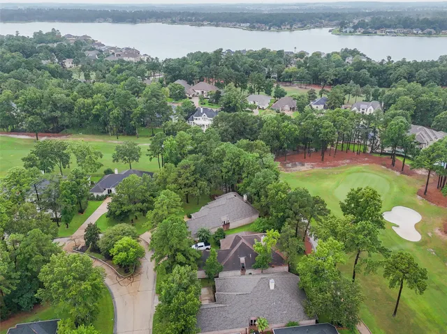 an aerial view of a house with yard swimming pool and outdoor seating