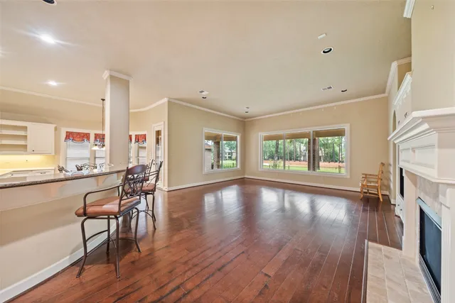 a view of a livingroom with furniture window and wooden floor
