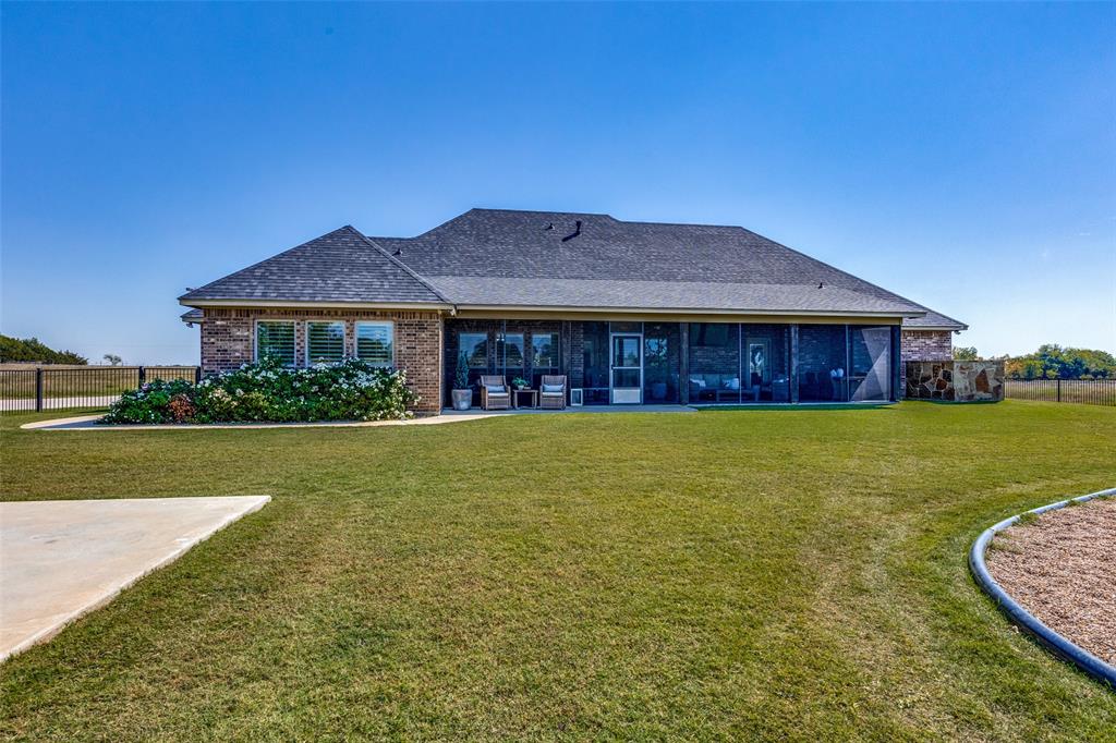 1150 Lone Star Road Bowie, TX 76230 - Photo 3 of 38 a front view of a house with garden