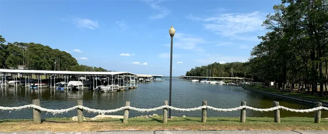 a view of a lake with outdoor seating space
