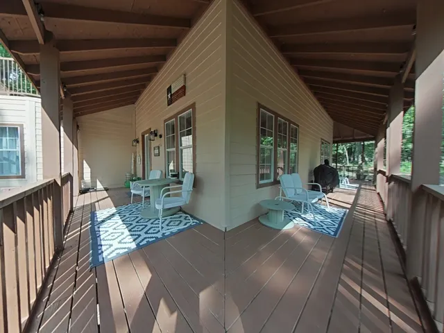 a view of living room and dining room with wooden floor
