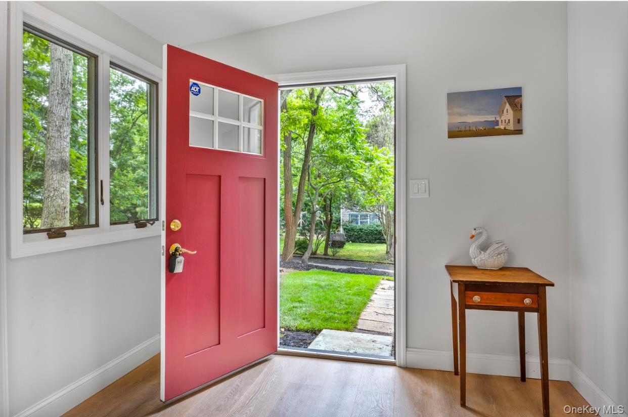 164 Maple Road Wading River, NY 11792 - Photo 4 of 19 Foyer entrance featuring wood finished floors and healthy amount of natural light