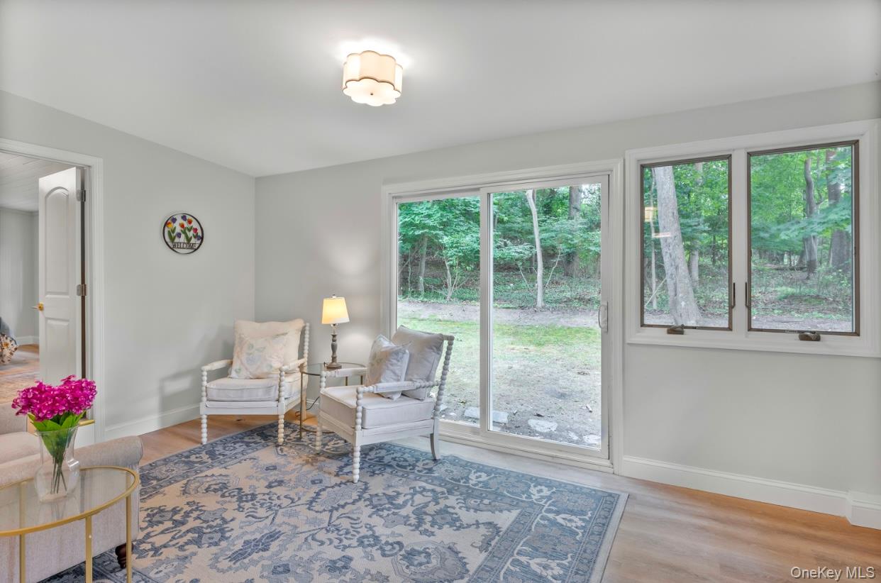 164 Maple Road Wading River, NY 11792 - Photo 8 of 19 Living area with light wood-type flooring and baseboards
