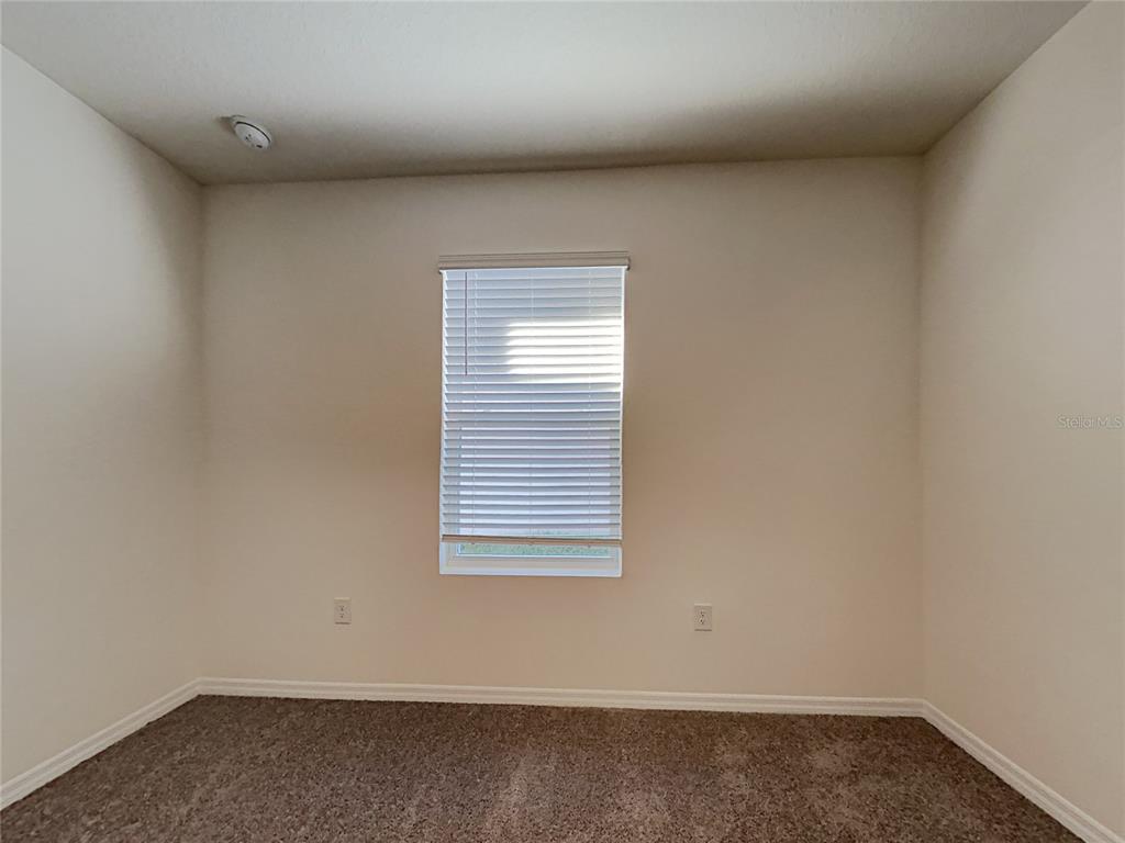 30985 Penny Surf Loop Wesley Chapel, FL 33545 - Photo 12 of 15 an empty room with a window