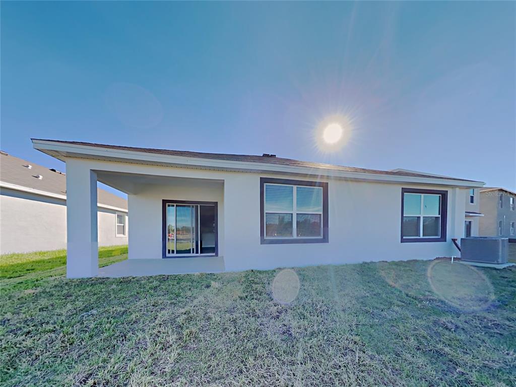30985 Penny Surf Loop Wesley Chapel, FL 33545 - Photo 15 of 15 front view of a house with a yard