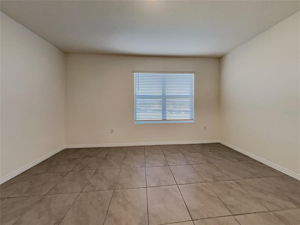 30985 Penny Surf Loop Wesley Chapel, FL 33545 - Photo 2 of 15 an empty room with windows