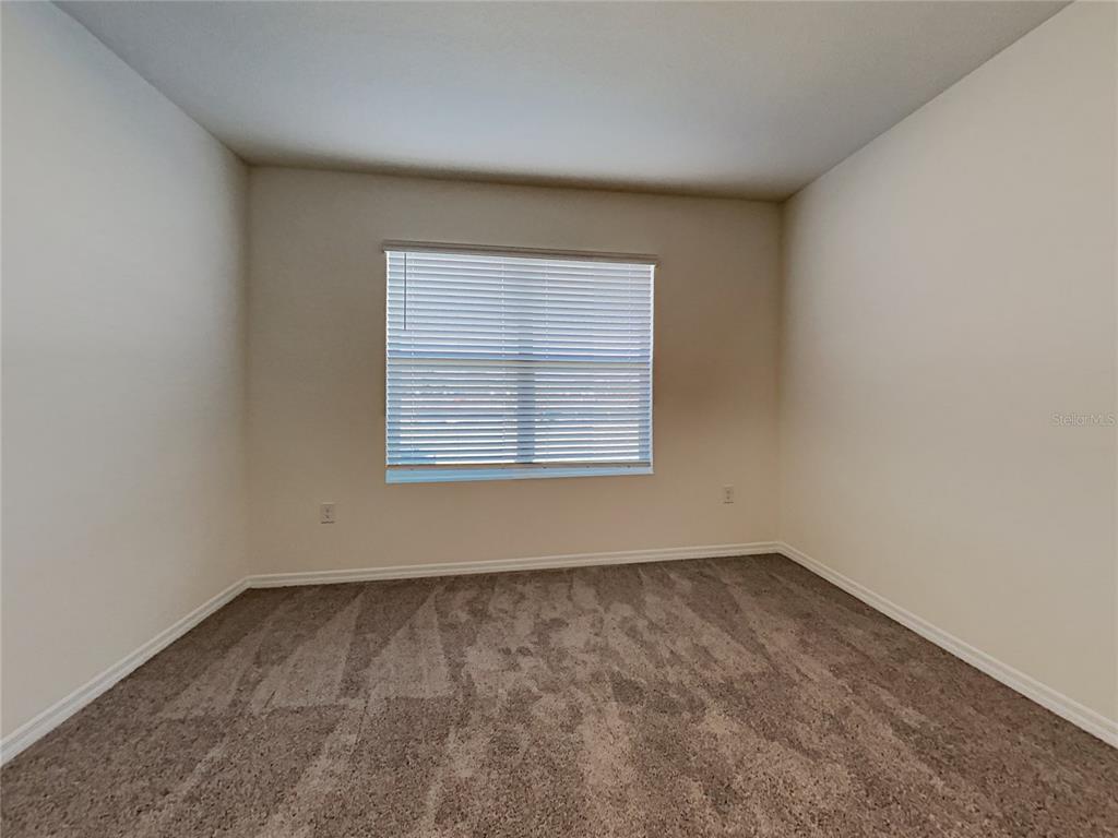 30985 Penny Surf Loop Wesley Chapel, FL 33545 - Photo 7 of 15 an empty room with a window