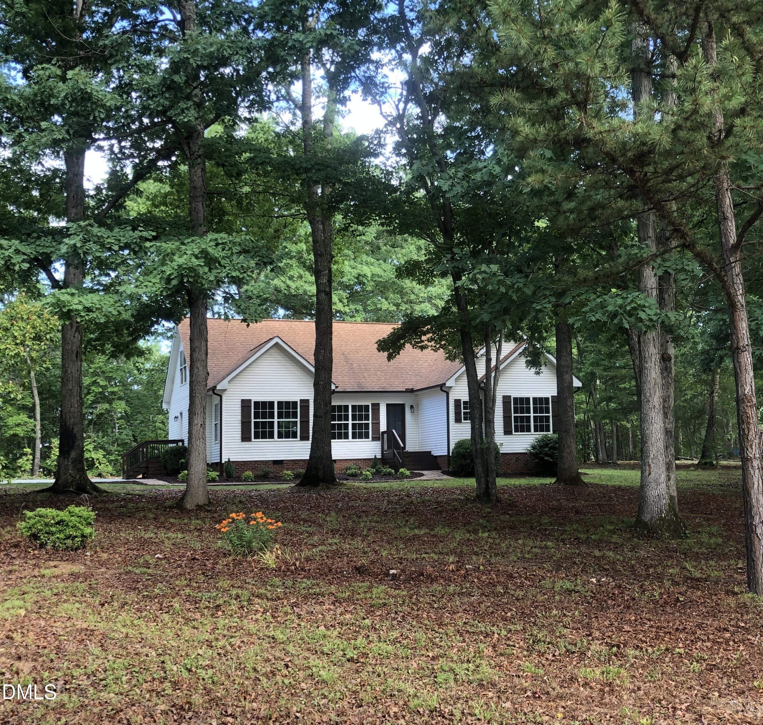 95 Smith Taylor Trail Roxboro, NC 27574 - Photo 14 of 47 a front view of a house with a garden